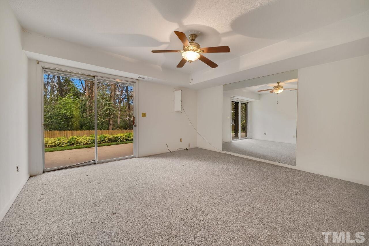 3413 Malibu Drive Raleigh, NC 27607 - Photo 12 of 30 a view of a livingroom with a ceiling fan and window