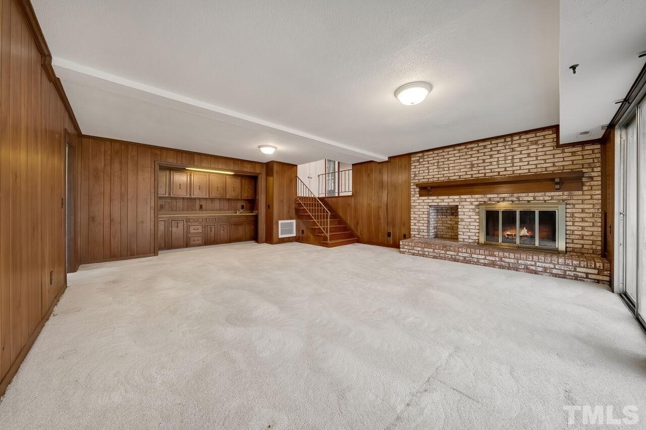 3413 Malibu Drive Raleigh, NC 27607 - Photo 15 of 30 a view of a livingroom with a fireplace