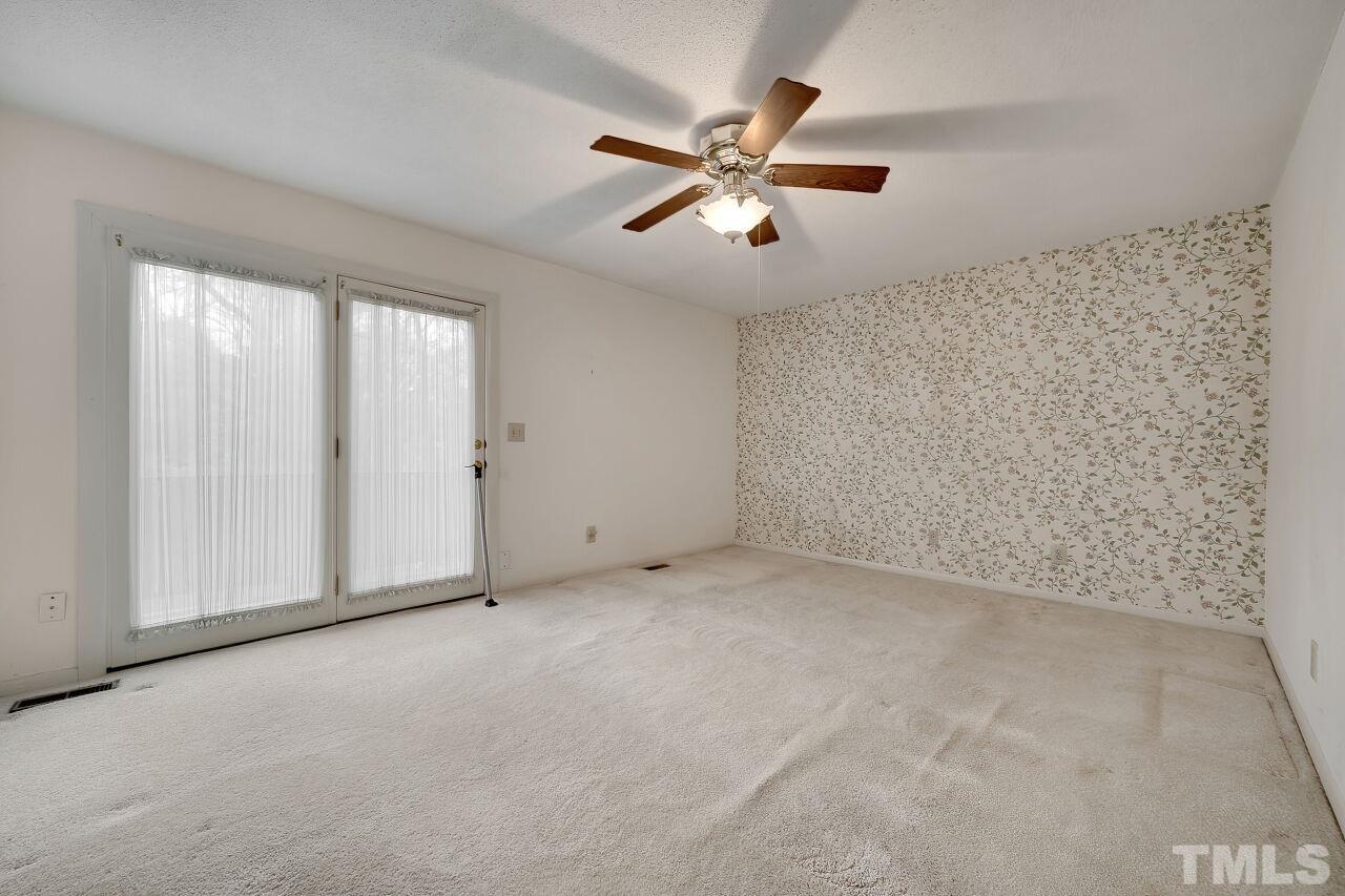 3413 Malibu Drive Raleigh, NC 27607 - Photo 19 of 30 an empty room with windows and fan
