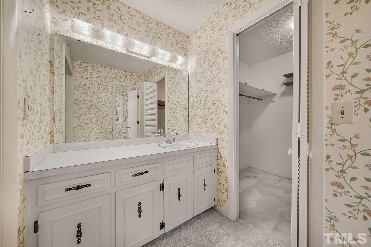 3413 Malibu Drive Raleigh, NC 27607 - Photo 20 of 30 a bathroom with a double vanity sink mirror and shower