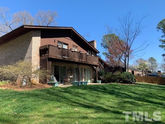 3413 Malibu Drive Raleigh, NC 27607 - Photo 2 of 30 a front view of a house with a garden