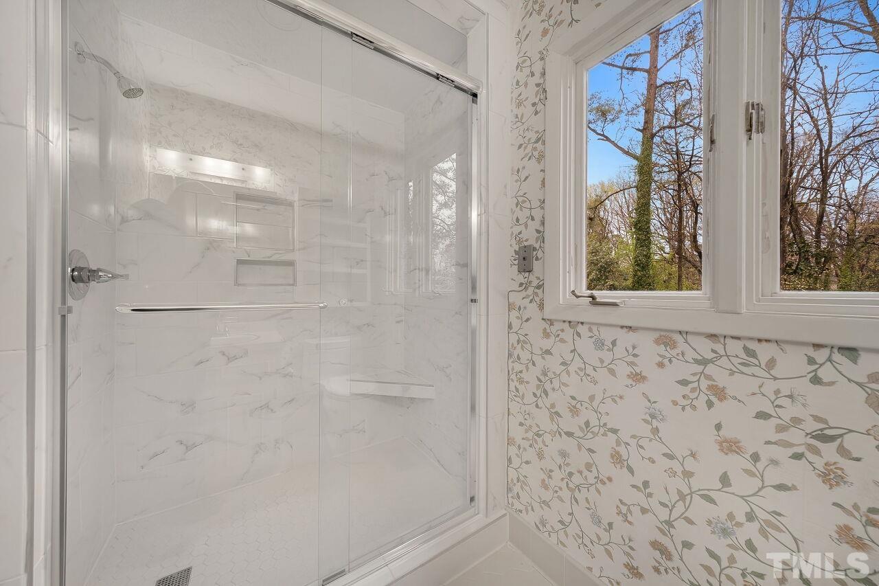 3413 Malibu Drive Raleigh, NC 27607 - Photo 22 of 30 a bathroom with a shower