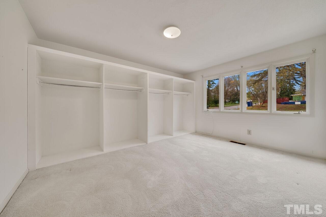 3413 Malibu Drive Raleigh, NC 27607 - Photo 23 of 30 an empty room with windows