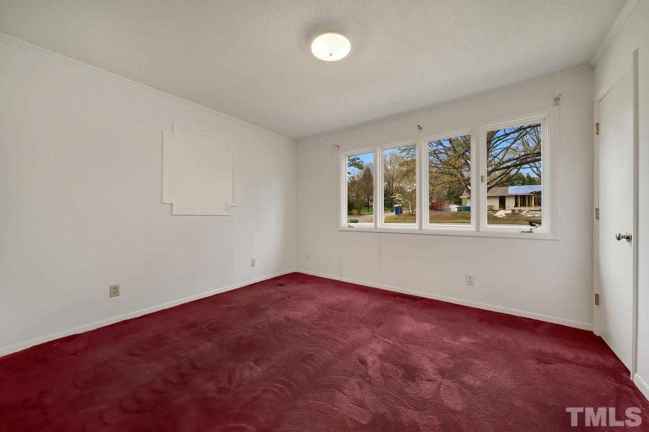3413 Malibu Drive Raleigh, NC 27607 - Photo 24 of 30 an empty room with windows