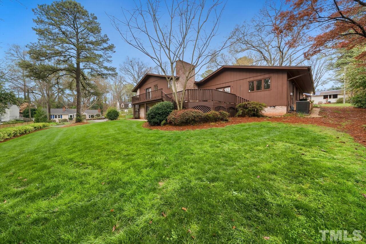 3413 Malibu Drive Raleigh, NC 27607 - Photo 27 of 30 a view of a house with a yard