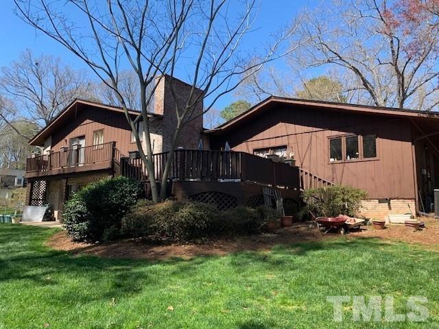 3413 Malibu Drive Raleigh, NC 27607 - Photo 3 of 30 a front view of a house with a garden