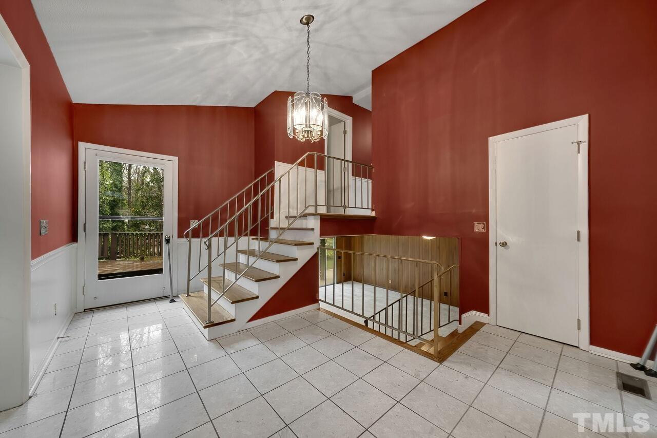 3413 Malibu Drive Raleigh, NC 27607 - Photo 4 of 30 a view of entryway with wooden floor