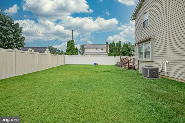 a view of a backyard with sitting area