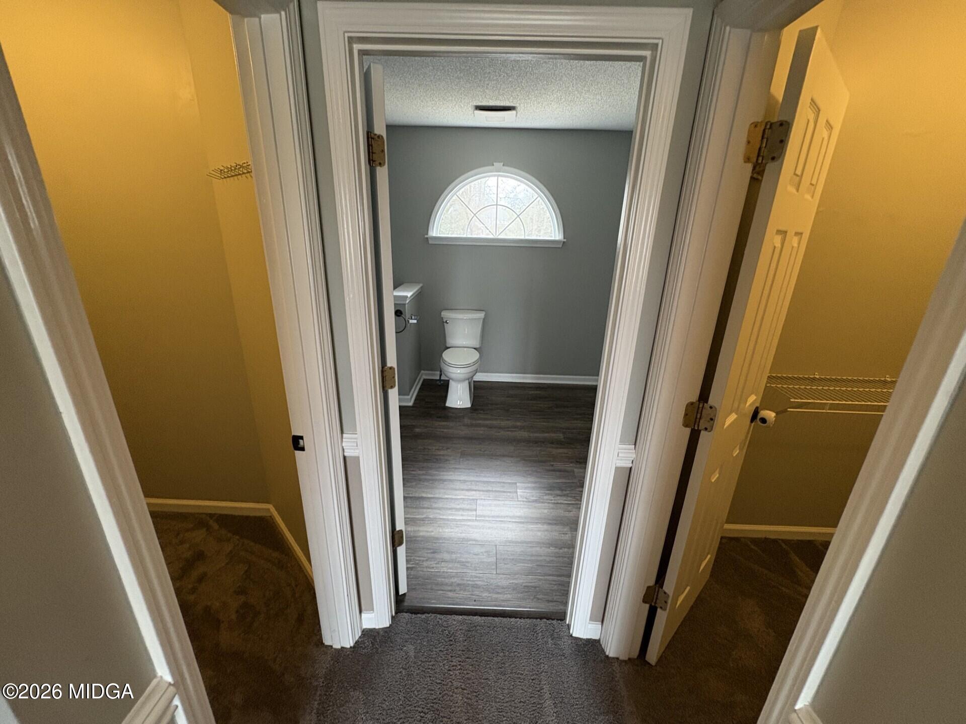 5081 Marshall Mill Road Lizella, GA 31052 - Photo 25 of 40 a view of a hallway with wooden floor and closet