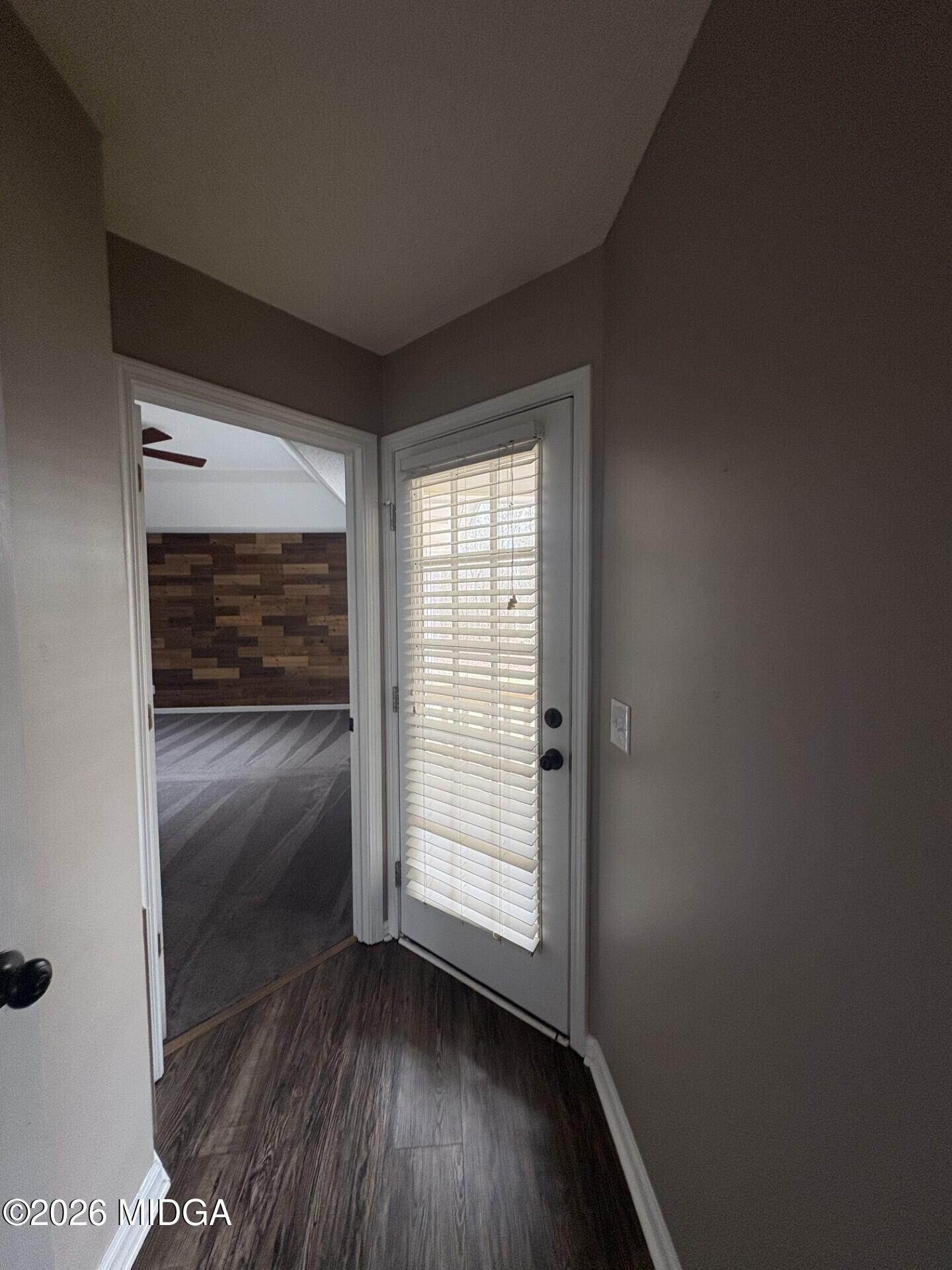 5081 Marshall Mill Road Lizella, GA 31052 - Photo 31 of 40 an empty room with wooden floor and windows