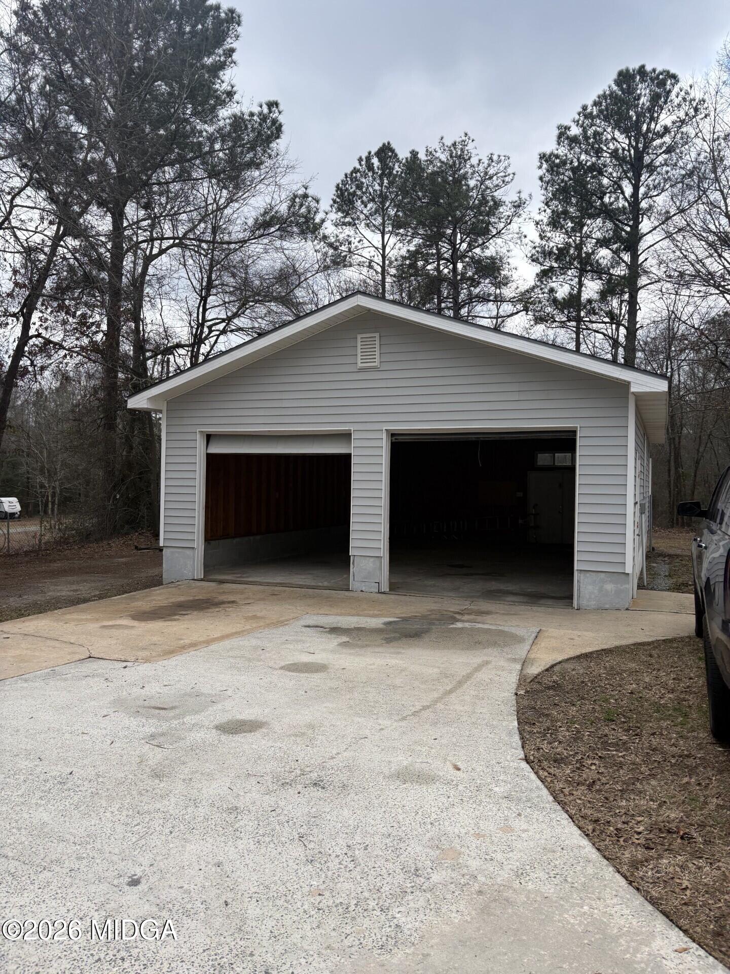 5081 Marshall Mill Road Lizella, GA 31052 - Photo 35 of 40 a front view of a house with yard and garage