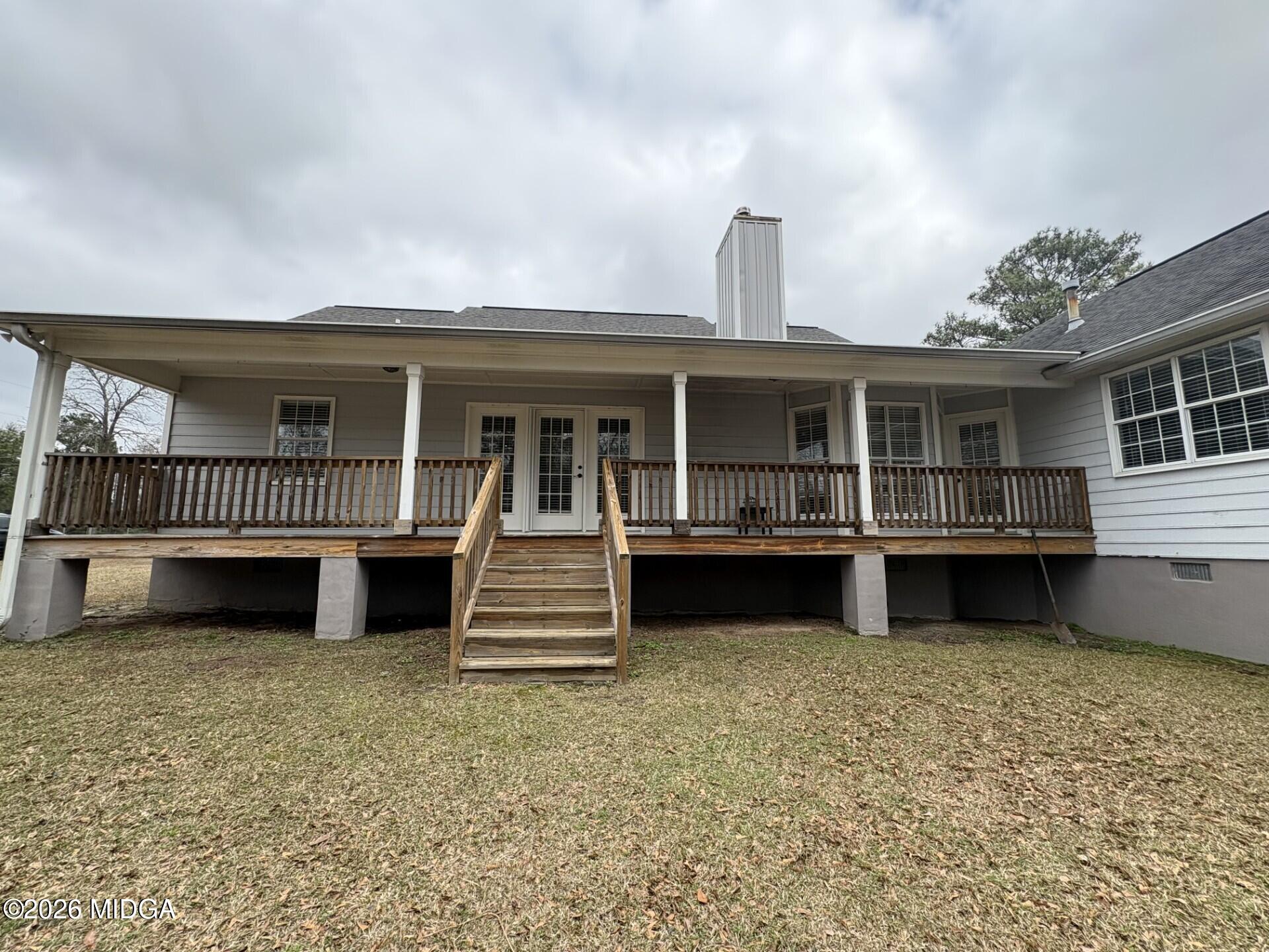 5081 Marshall Mill Road Lizella, GA 31052 - Photo 8 of 40 a view of house and outdoor space with deck