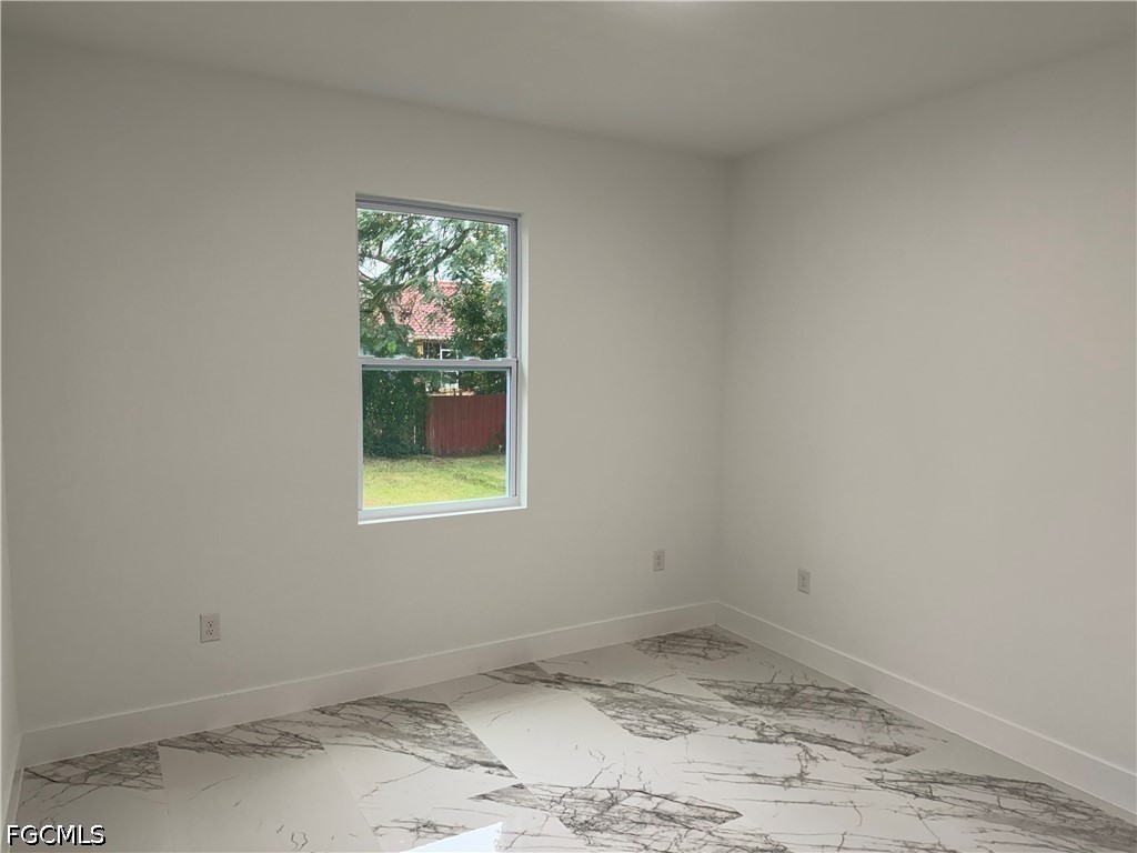 3203 24th Street Southwest Lehigh Acres, FL 33976 - Photo 15 of 19 a view of a window in a room