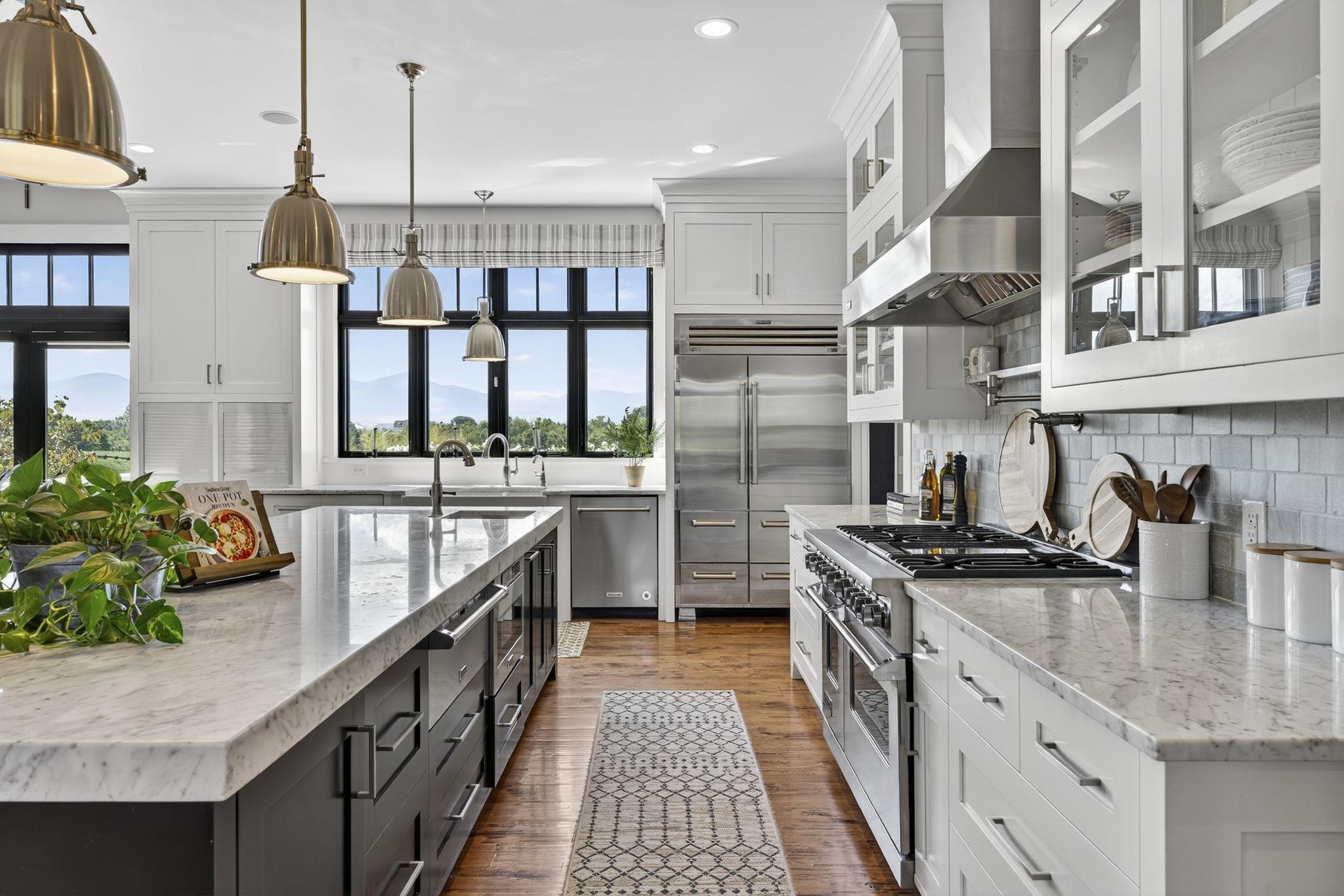 1614 Three Springs Road McGaheysville, VA 22840 - Photo 11 of 75 a kitchen with stainless steel appliances granite countertop a sink a stove and a wooden floors