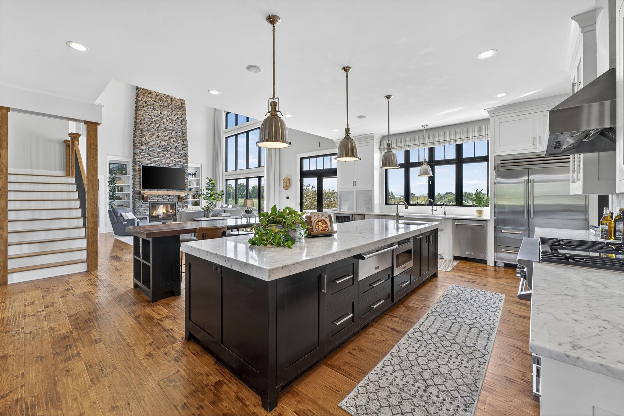 1614 Three Springs Road McGaheysville, VA 22840 - Photo 12 of 75 a kitchen with stainless steel appliances granite countertop a stove a sink and a refrigerator