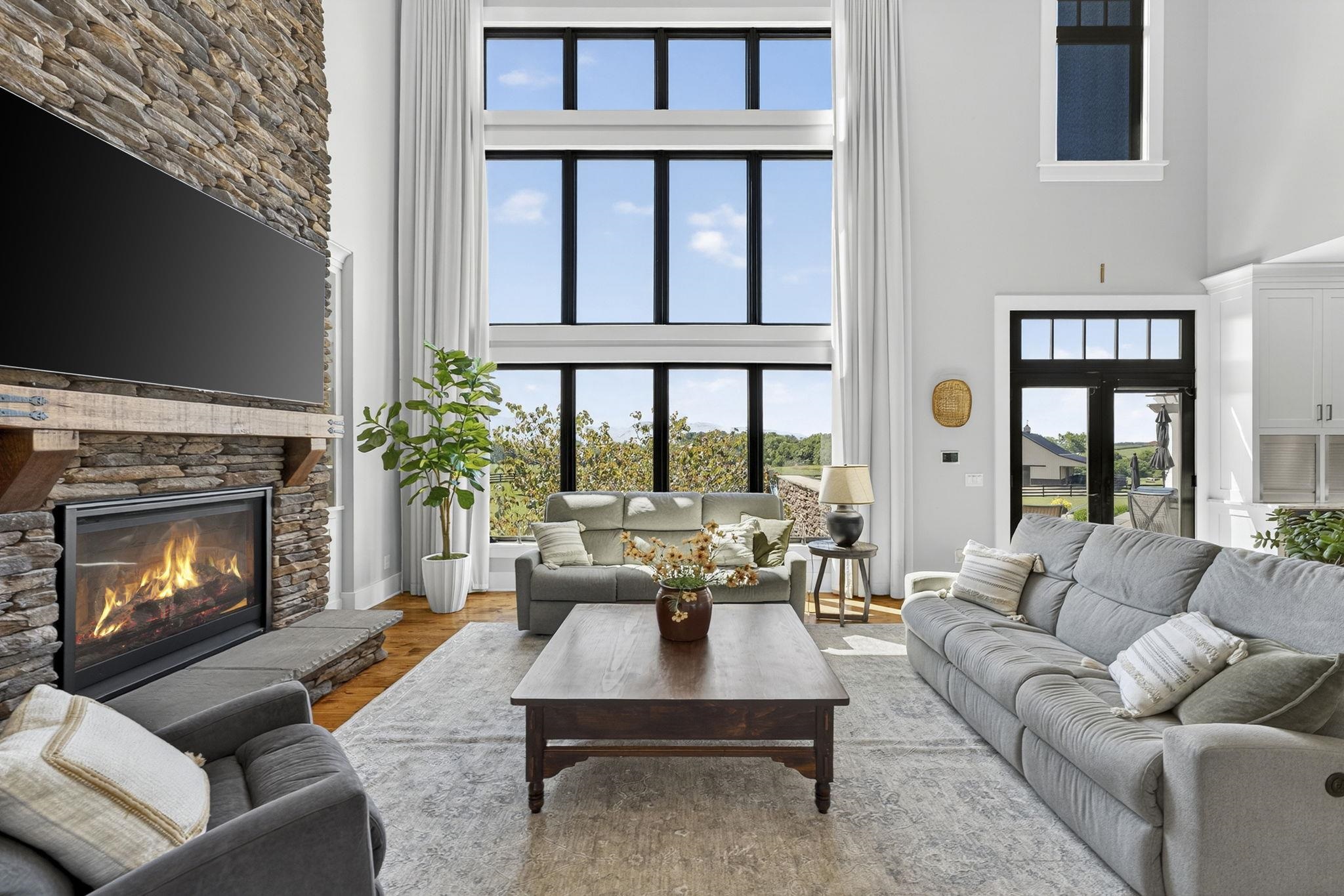 1614 Three Springs Road McGaheysville, VA 22840 - Photo 15 of 75 a living room with furniture a fireplace and a flat screen tv