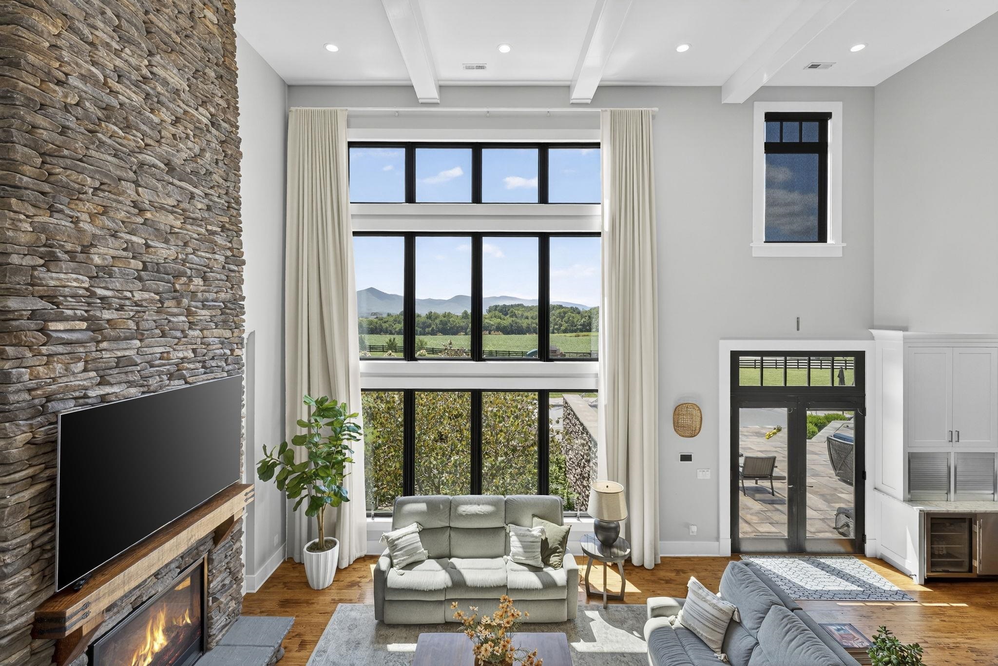 1614 Three Springs Road McGaheysville, VA 22840 - Photo 32 of 75 a living room with furniture windows and a flat screen tv