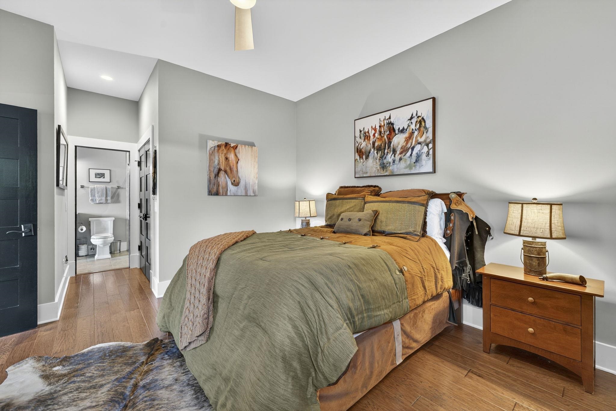 1614 Three Springs Road McGaheysville, VA 22840 - Photo 51 of 75 a bedroom with a bed and a lamp on dresser