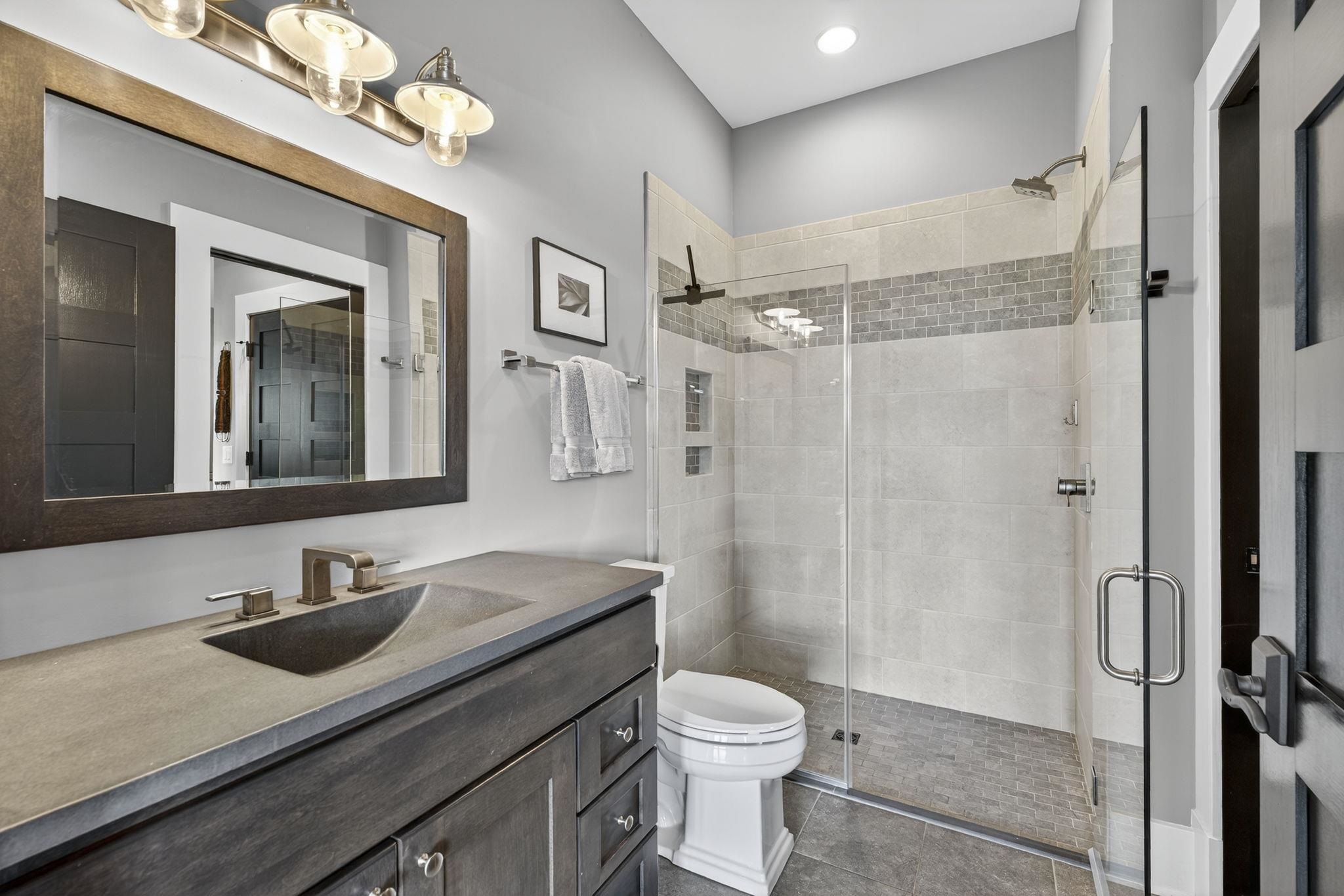 1614 Three Springs Road McGaheysville, VA 22840 - Photo 52 of 75 a bathroom with a sink toilet a mirror and shower
