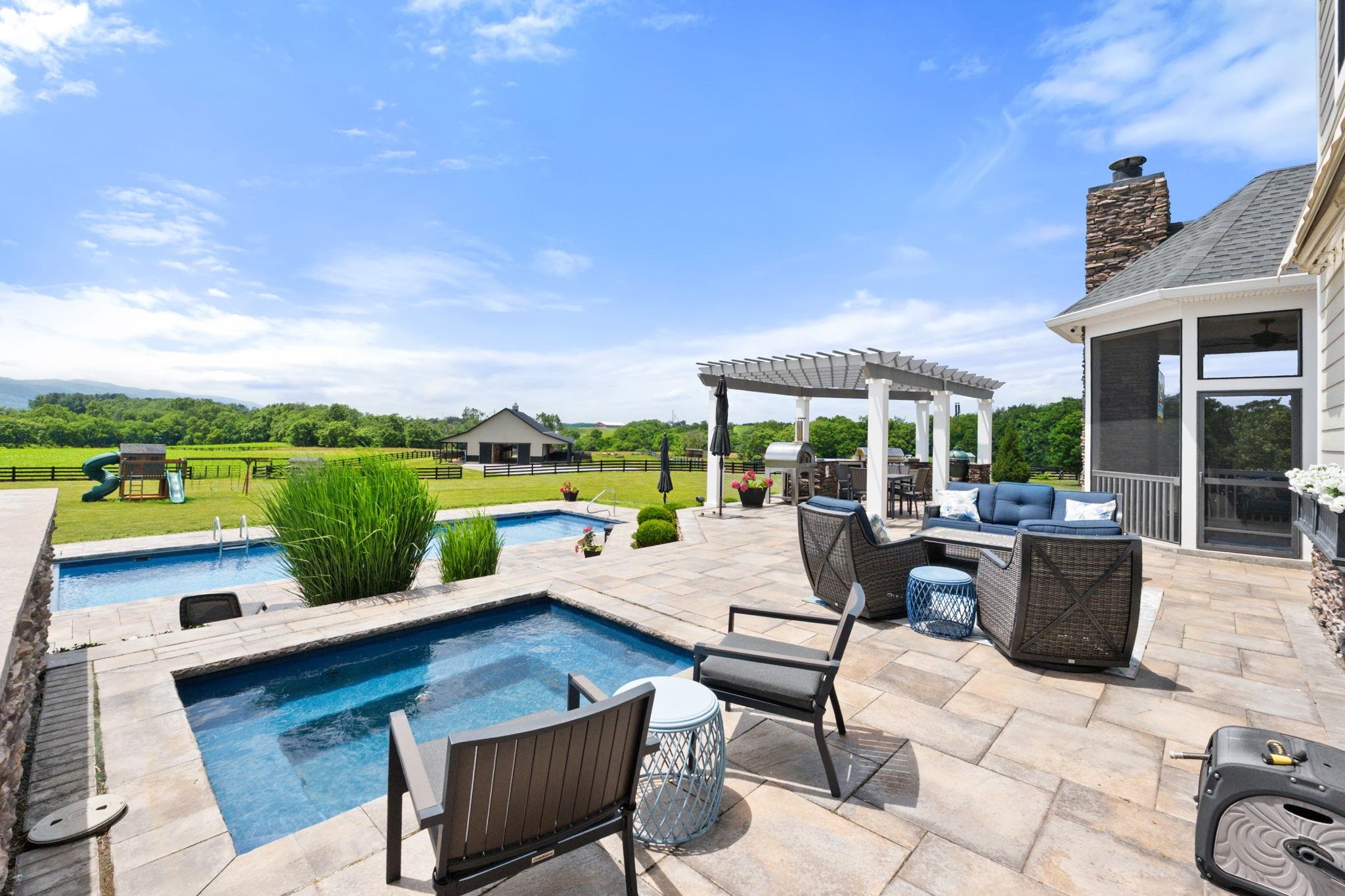 1614 Three Springs Road McGaheysville, VA 22840 - Photo 54 of 75 a view of a patio with couches chairs and a table and chairs