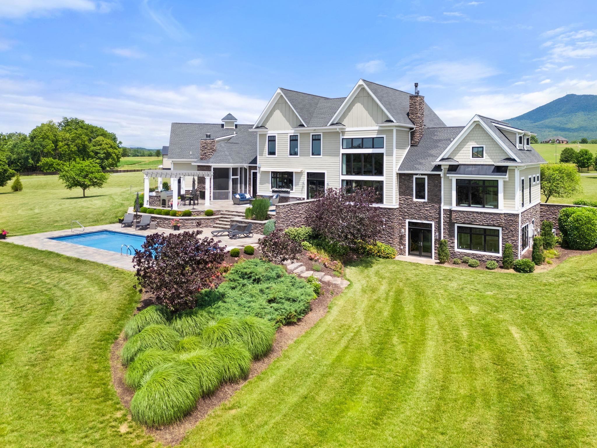 1614 Three Springs Road McGaheysville, VA 22840 - Photo 61 of 75 a front view of a house with a big yard and potted plants