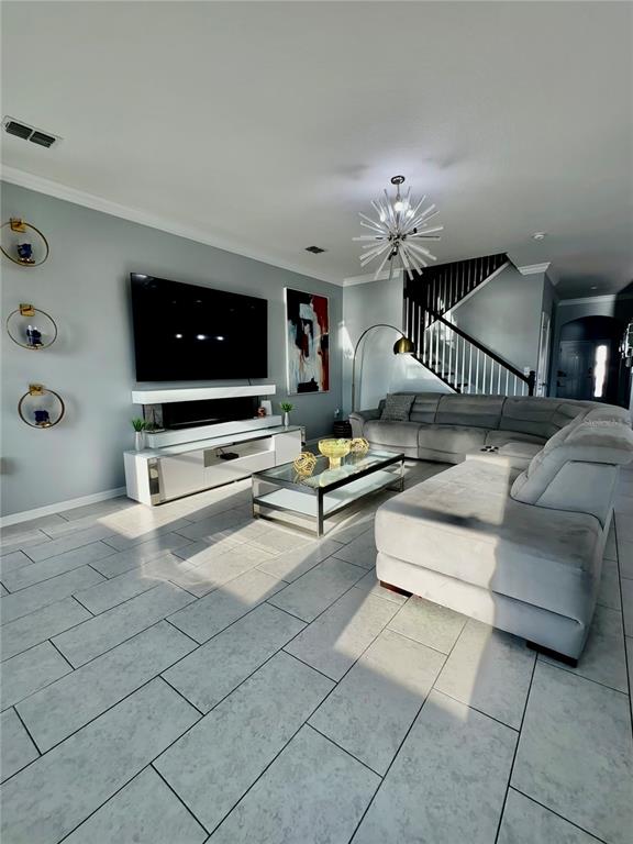 12351 Northover Loop Orlando, FL 32824 - Photo 22 of 58 a living room with furniture and a flat screen tv