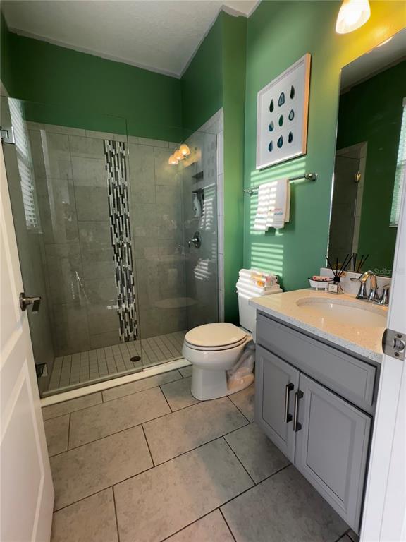 12351 Northover Loop Orlando, FL 32824 - Photo 27 of 58 a bathroom with a sink toilet and shower