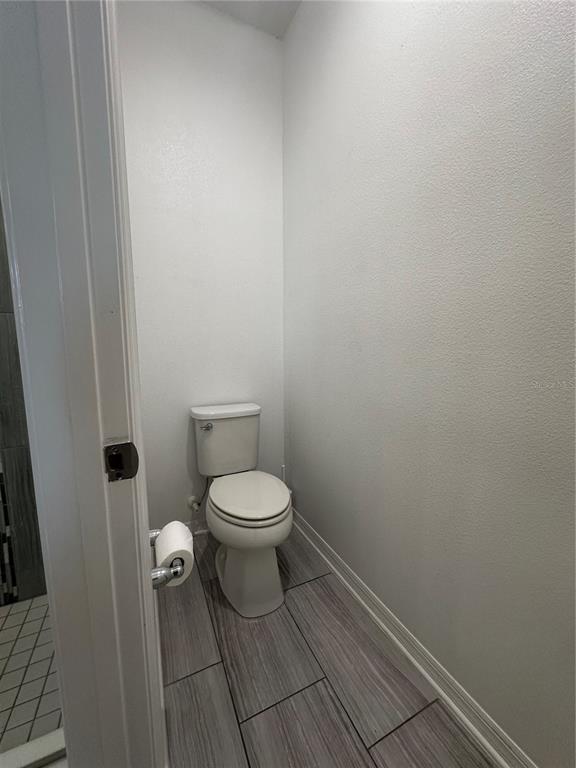 12351 Northover Loop Orlando, FL 32824 - Photo 31 of 58 a white toilet sitting next to a white sink