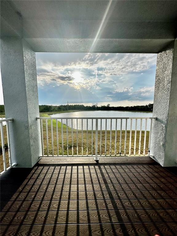 12351 Northover Loop Orlando, FL 32824 - Photo 41 of 58 a view of a balcony with wooden floor
