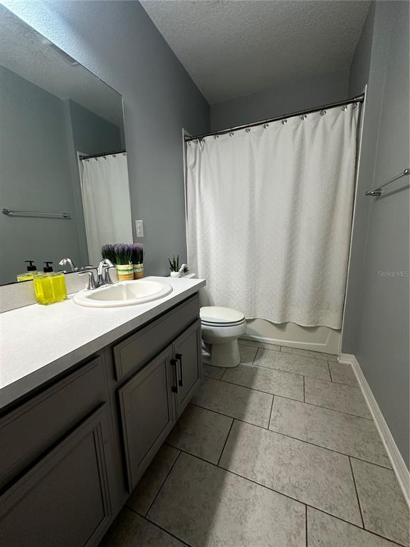 12351 Northover Loop Orlando, FL 32824 - Photo 45 of 58 a bathroom with a sink and a mirror