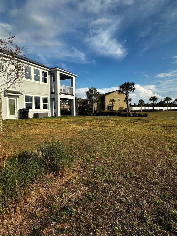 12351 Northover Loop Orlando, FL 32824 - Photo 56 of 58 a view of a building with a yard