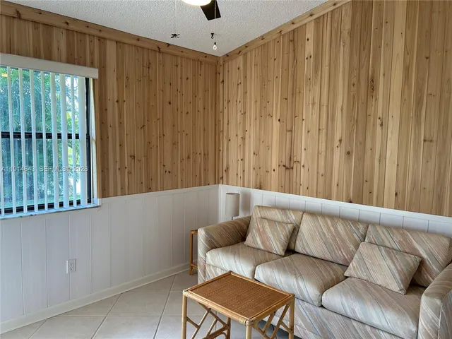 a living room with a couch and a shower