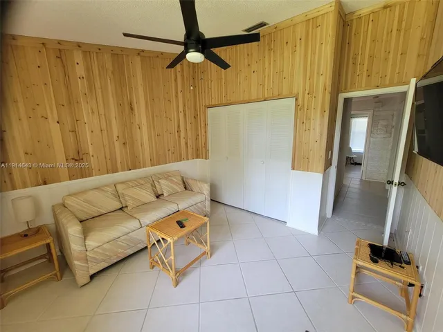 a living room with a couch and a shower