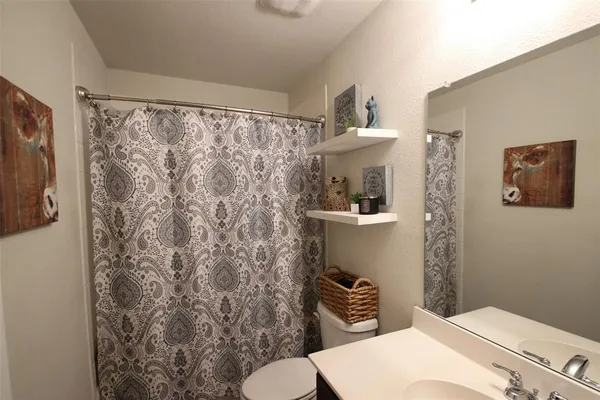 a bedroom with a bed and flat screen tv
