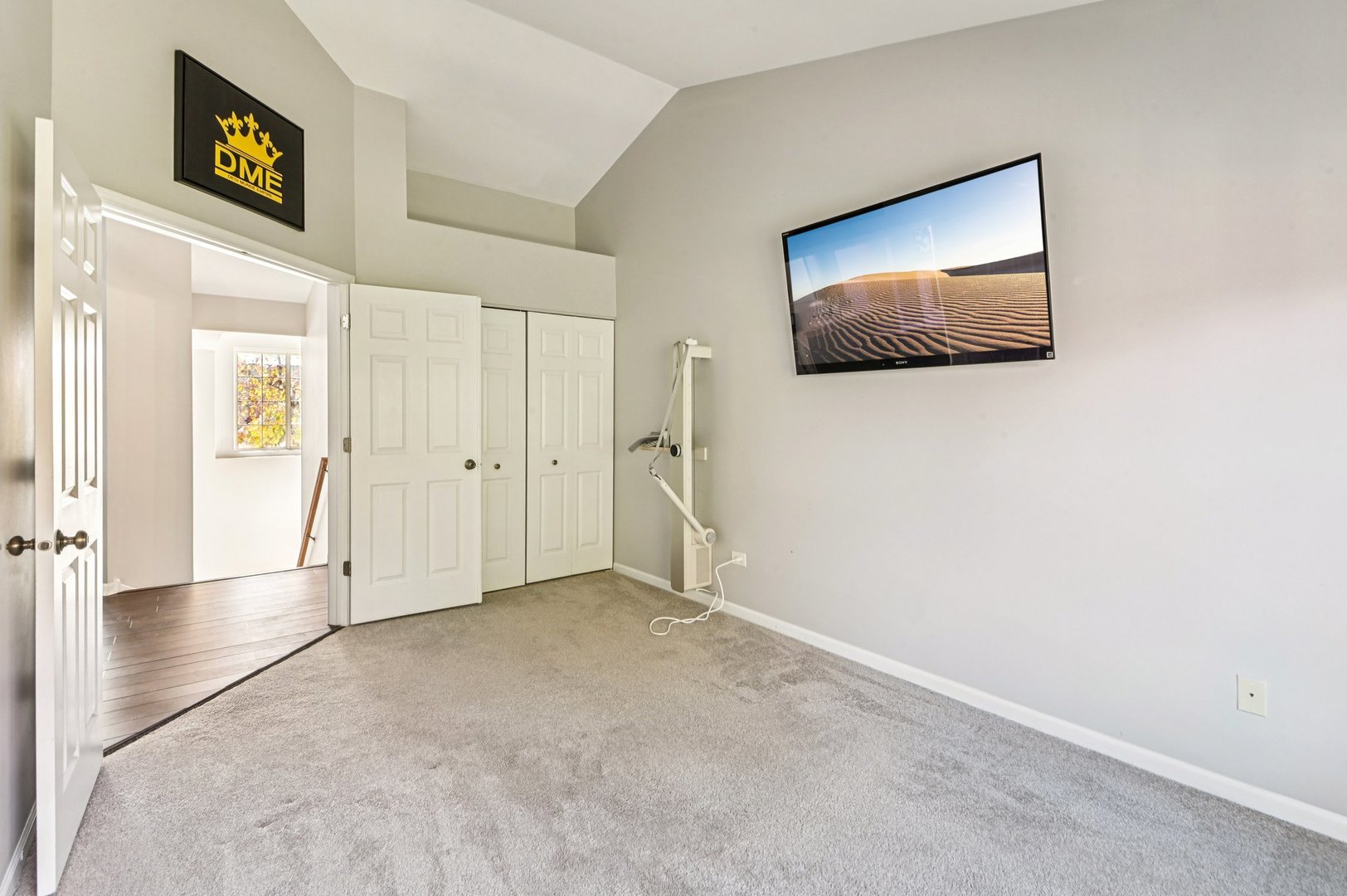 2227 Waterleaf Court, Unit 203 Naperville, IL 60564 - Photo 14 of 28 a view of an empty room with wooden floor and a bathroom