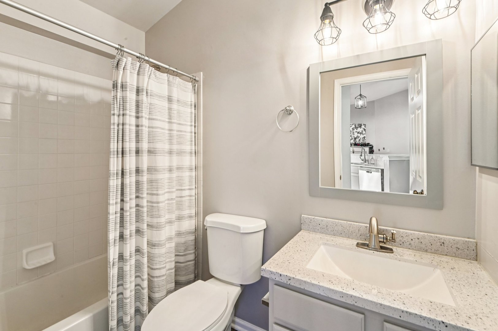 2227 Waterleaf Court, Unit 203 Naperville, IL 60564 - Photo 15 of 28 a bathroom with a sink a toilet and shower