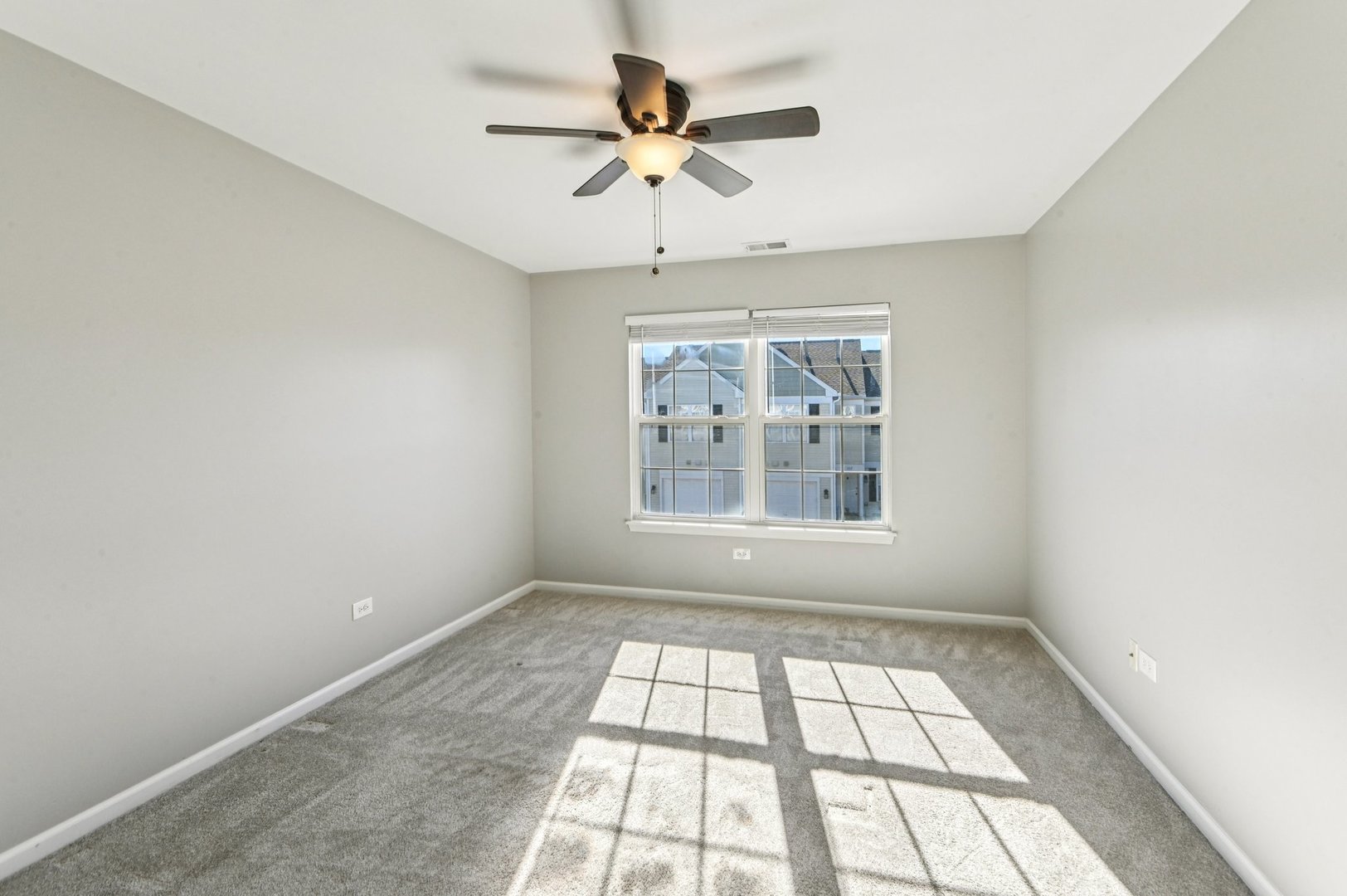 2227 Waterleaf Court, Unit 203 Naperville, IL 60564 - Photo 16 of 28 an empty room with windows and ceiling fan