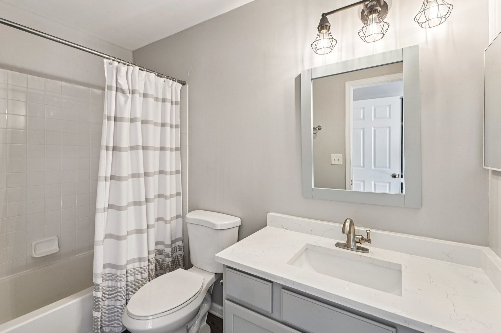 2227 Waterleaf Court, Unit 203 Naperville, IL 60564 - Photo 19 of 28 a bathroom with a sink a toilet and shower