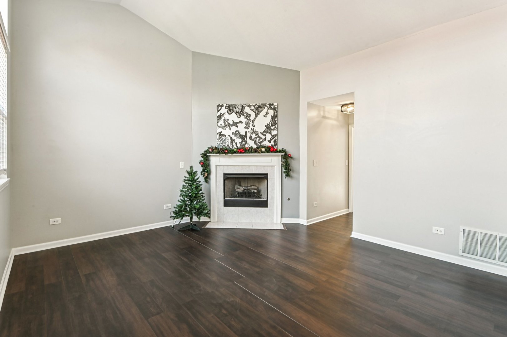 2227 Waterleaf Court, Unit 203 Naperville, IL 60564 - Photo 3 of 28 an empty room with wooden floor fireplace and windows