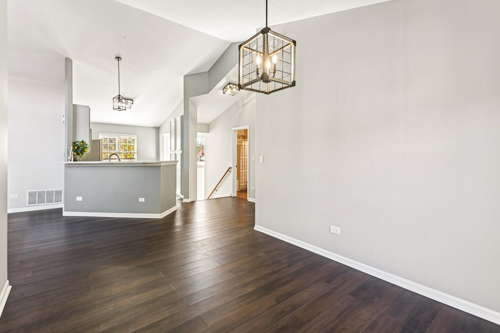 2227 Waterleaf Court, Unit 203 Naperville, IL 60564 - Photo 6 of 28 a view of an empty room with wooden floor and windows