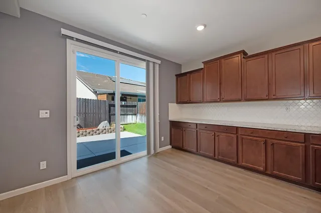 a kitchen with wooden cabinets and a sink