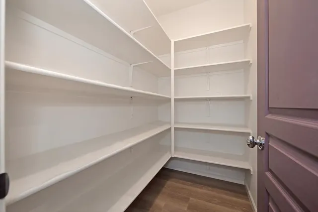 a view of an empty walk in closet