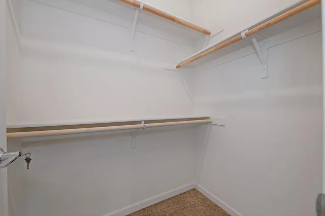 a bathroom with a toilet a sink and a mirror