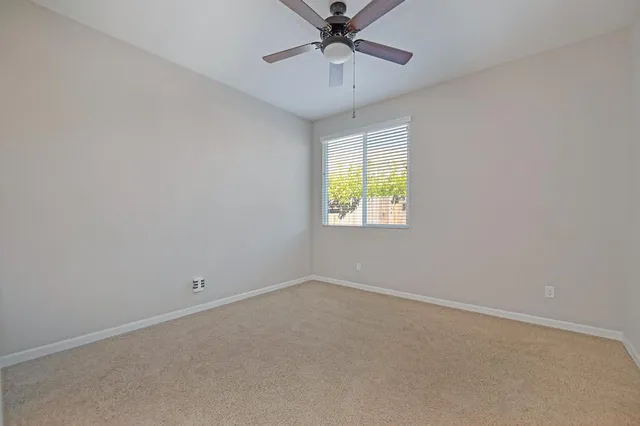 a bathroom with a granite countertop sink mirror and a
