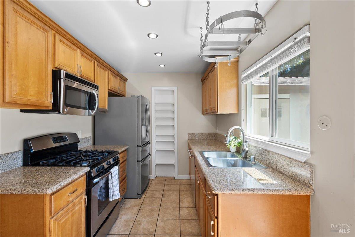 303 Algiers Court Santa Rosa, CA 95409 - Photo 9 of 27 Solid wood cabinets, granite counters, and newer appliances.