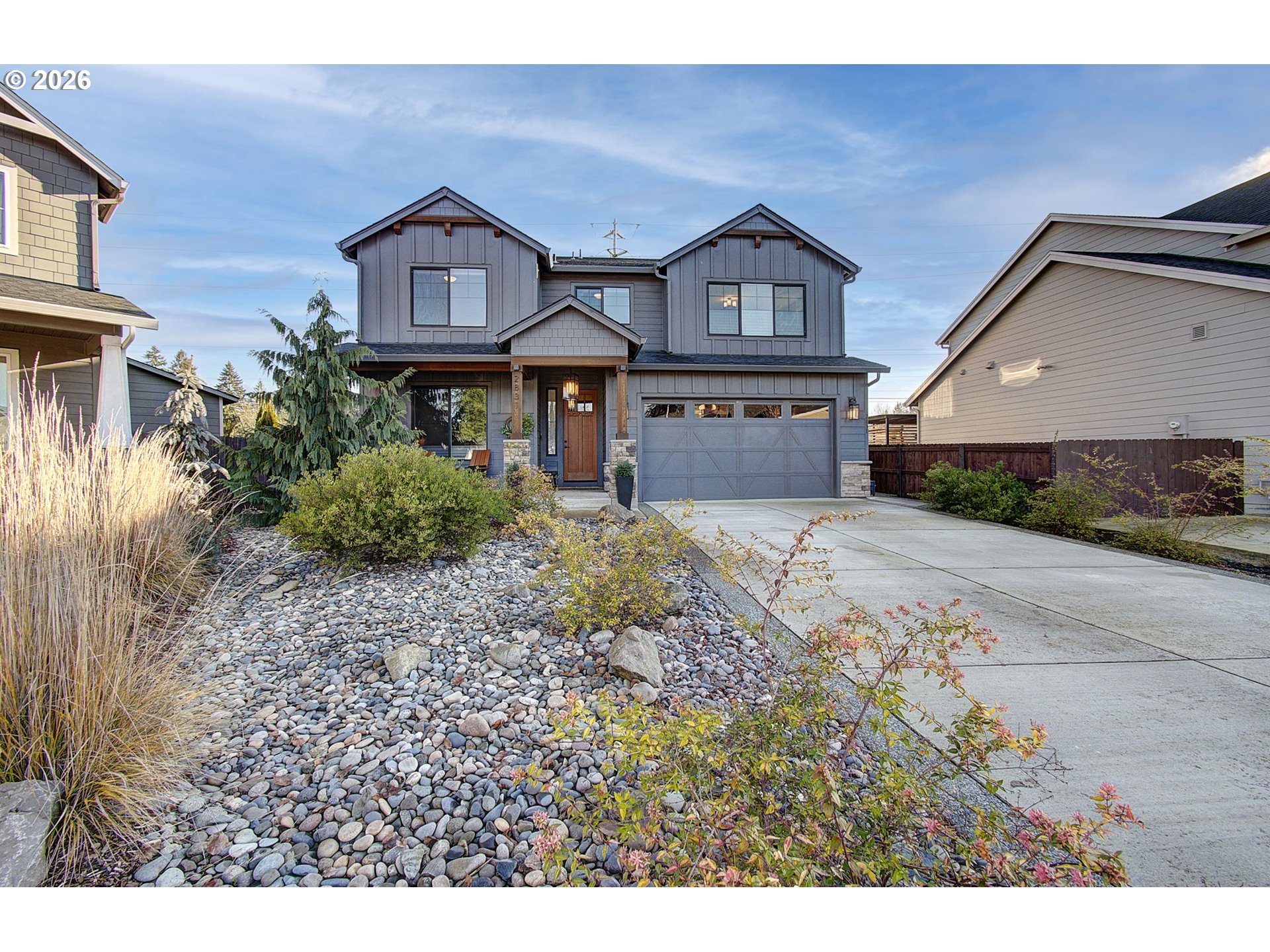 a front view of a house with a yard and garage