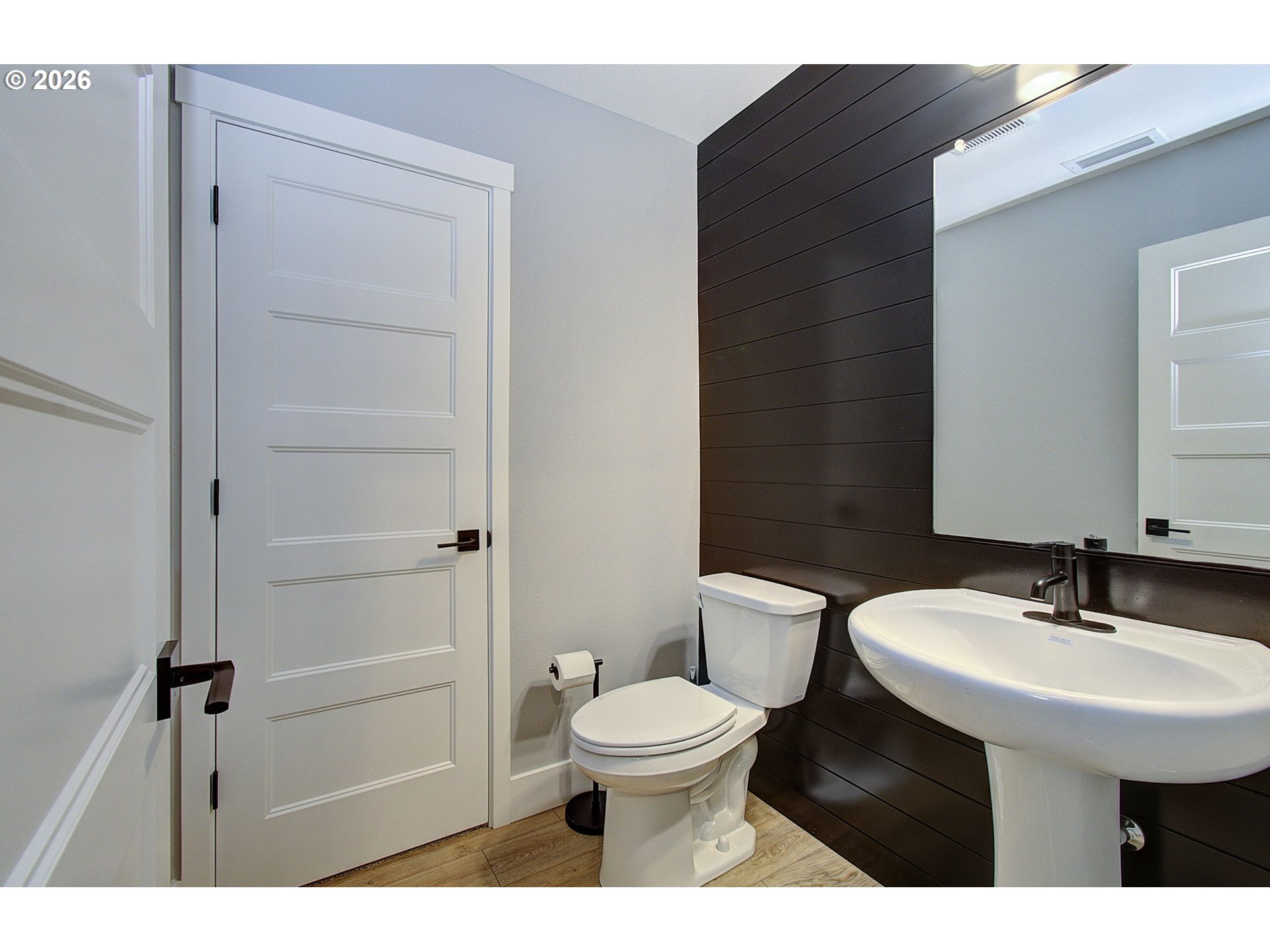 2831 Northeast 9th Avenue Battle Ground, WA 98604 - Photo 12 of 43 a bathroom with a sink a toilet and a mirror