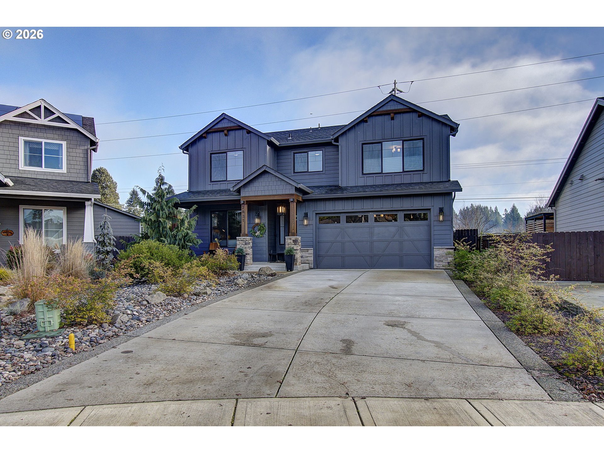 2831 Northeast 9th Avenue Battle Ground, WA 98604 - Photo 2 of 43 a front view of a house with garden