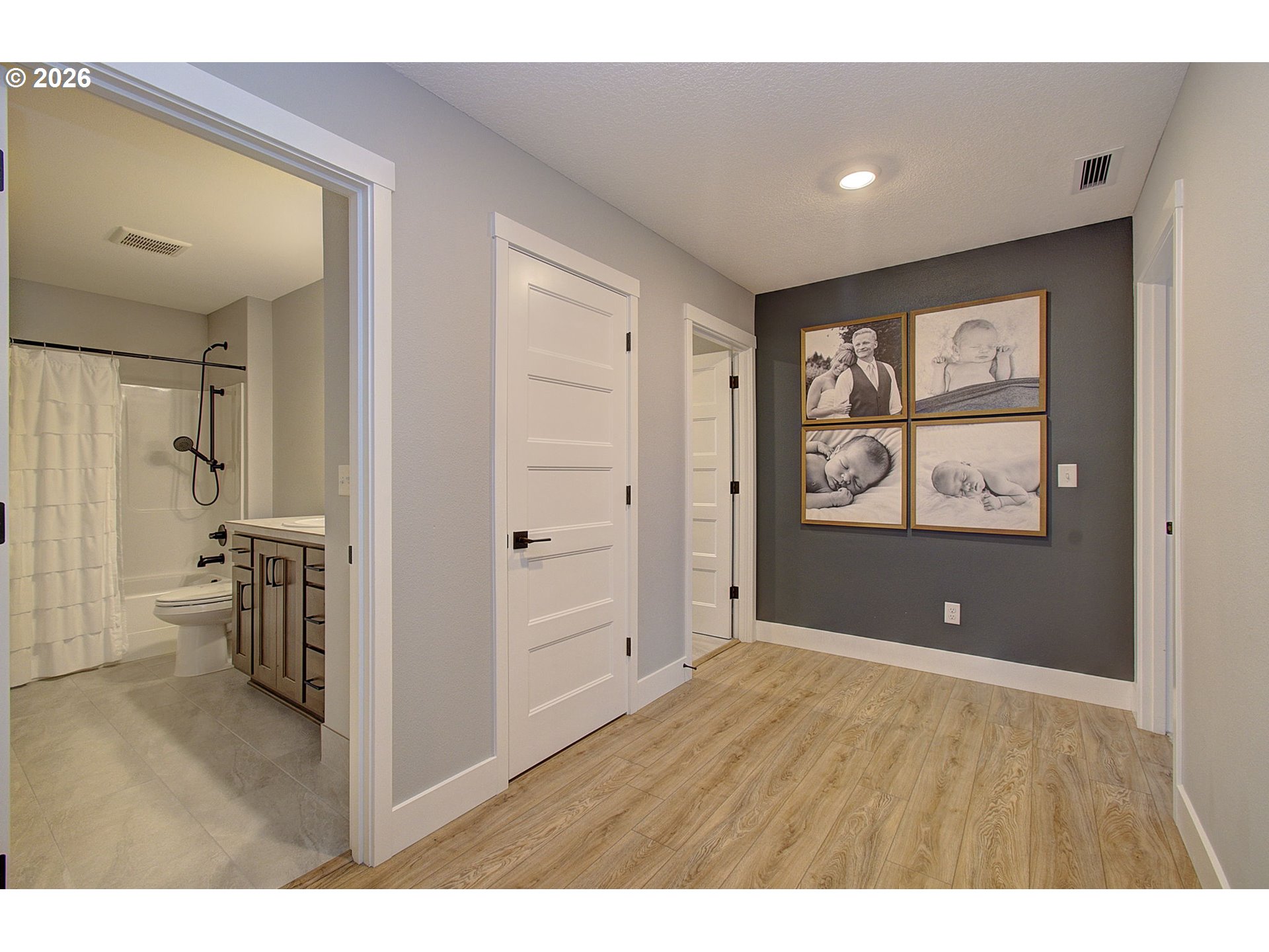 2831 Northeast 9th Avenue Battle Ground, WA 98604 - Photo 23 of 43 a view of a big room with wooden floor and windows