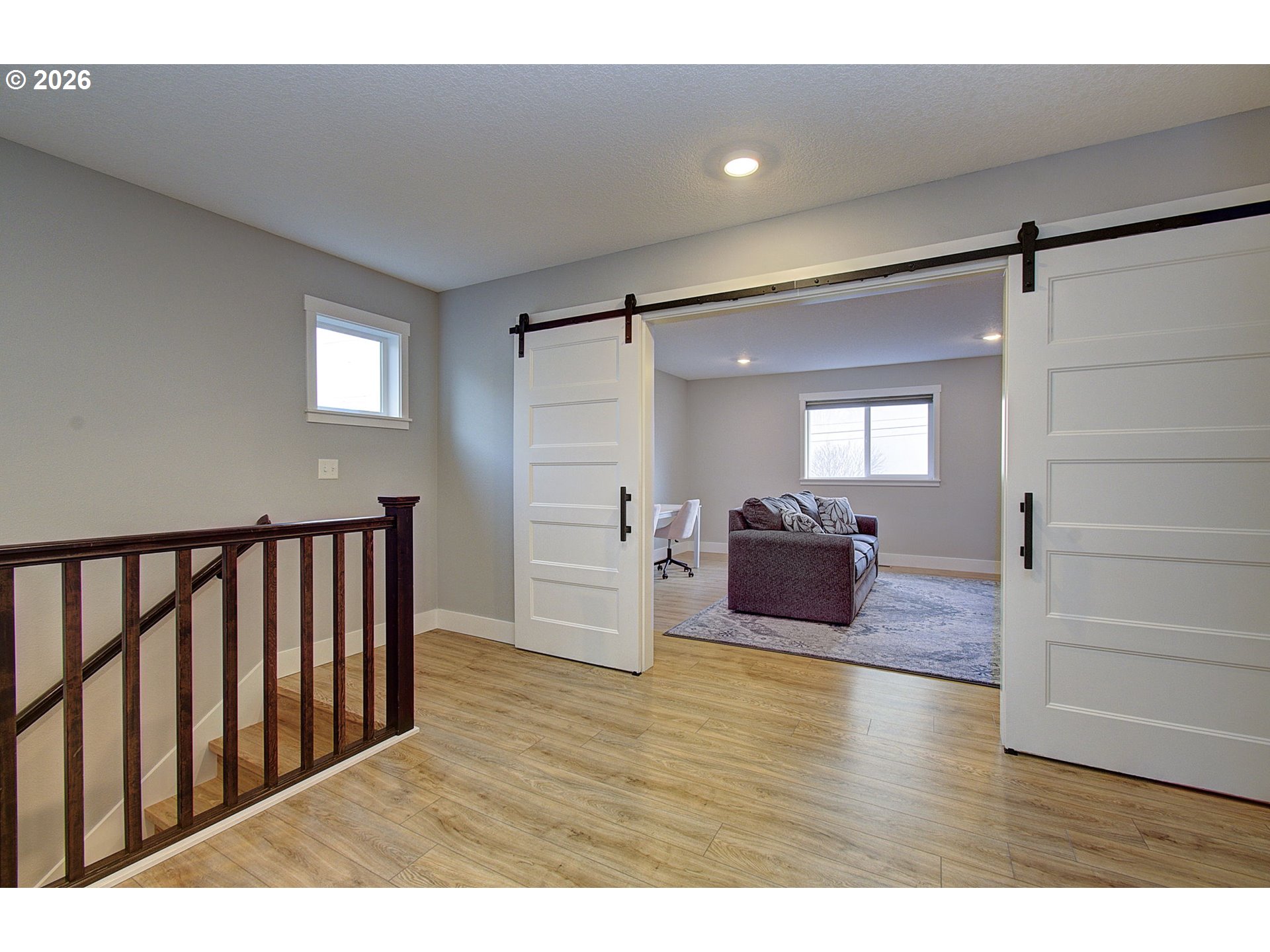 2831 Northeast 9th Avenue Battle Ground, WA 98604 - Photo 24 of 43 a hall with wooden floor and windows